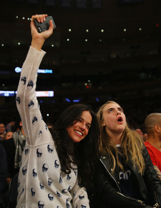 Illustration for article titled Michelle Rodriguez Got Drunk, Made Out With A Model At The Knicks Game